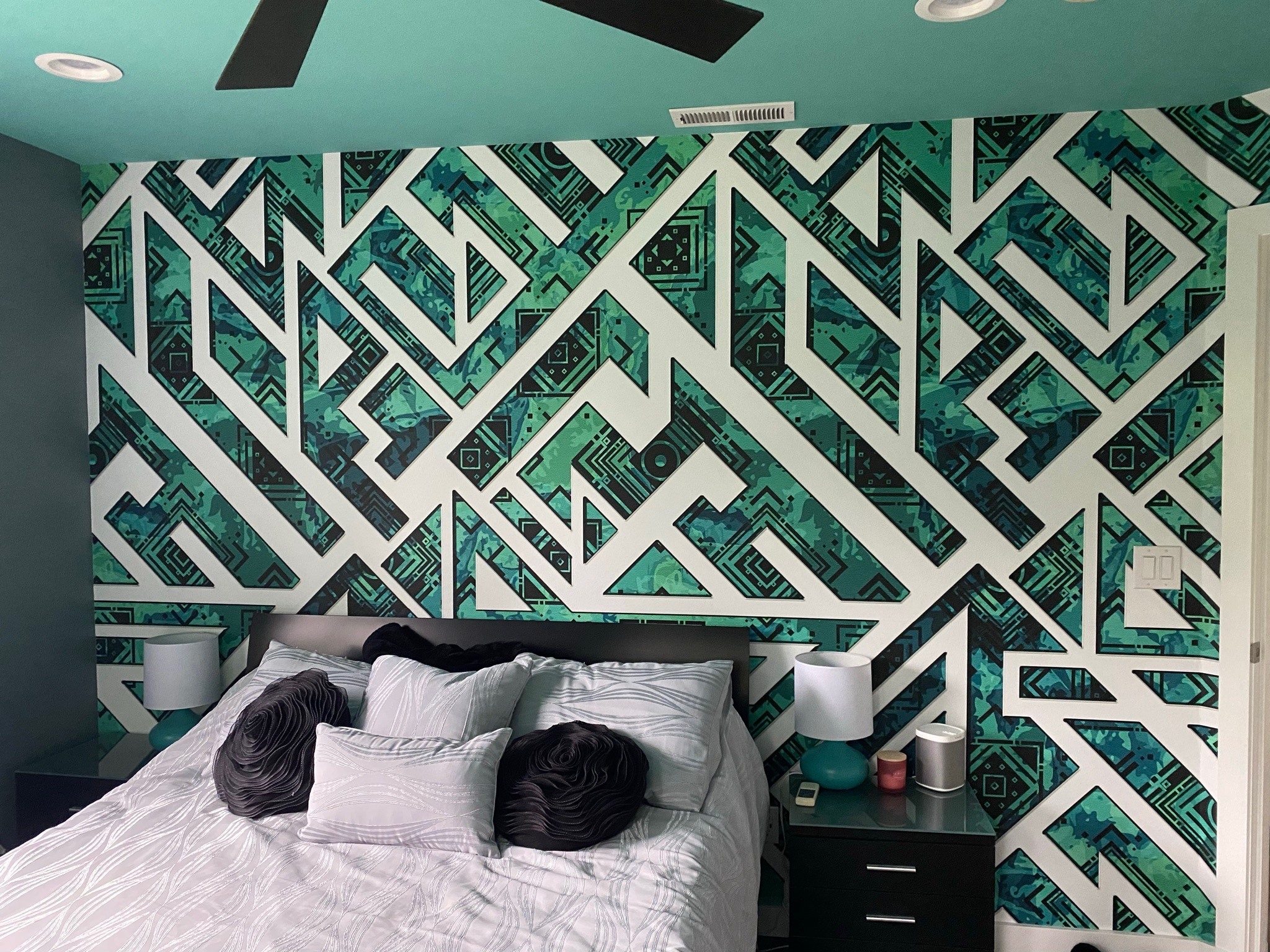 White geometric lines over teal and black bedroom wall graphics