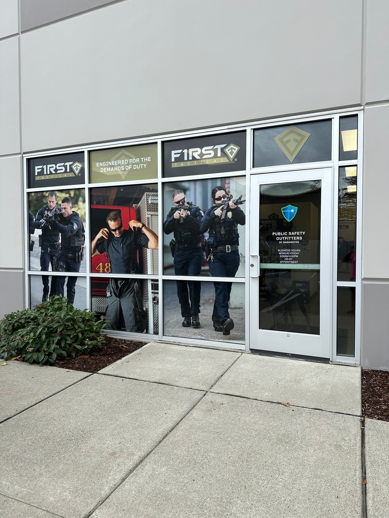 First Tactical storefront with photographic window graphics and branded entrance
